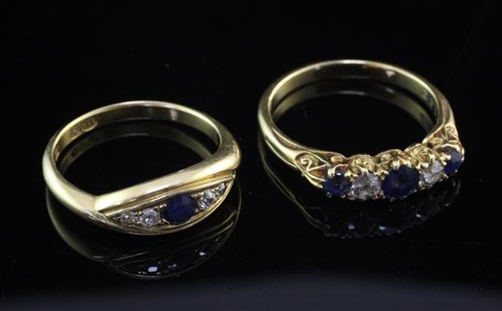 Two early 20th century 18ct gold, diamond and sapphire rings, sizes M & P.